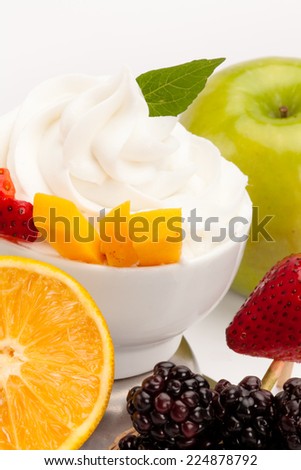 Yogurt ice cream with fresh fruits and marmalade