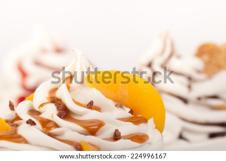 Set of yogurt ice cream with fresh fruits, toppings, marmalade, chocolate and caramel