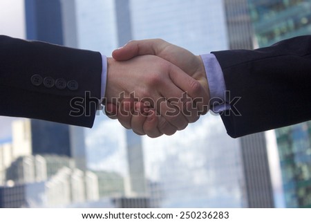 Handshake of businessman in suits