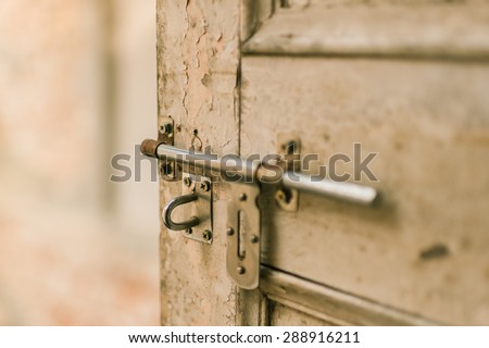Sliding lock with wood door