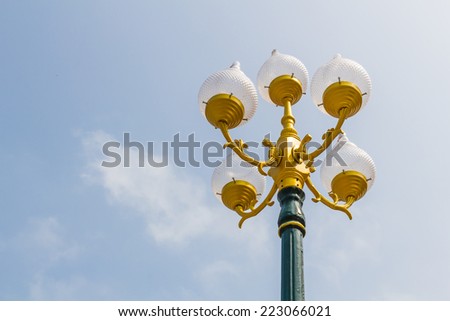 Outdoor public lighting pole with blue sky background