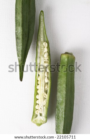 green okra, organic vegetable that good for health. Slice and see white seed inside.