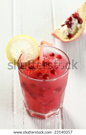 pomegranate juice, seed in a glass, look fresh and juicy, high beta-carotene, good for health.