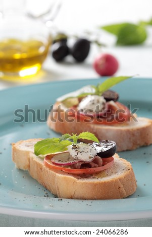 fusion food of parma ham and white cheese dressed up with tomato, redish, grape and italian basil.