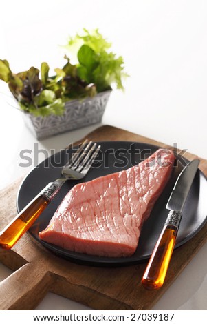 red raw beef, sirloin steak, is prepared to cook.