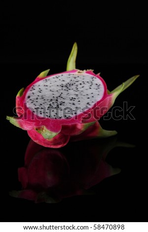 sliced pitahaya or dragon fruit on black background.