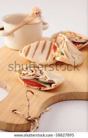 pita sandwich with chicken and salad. On white background