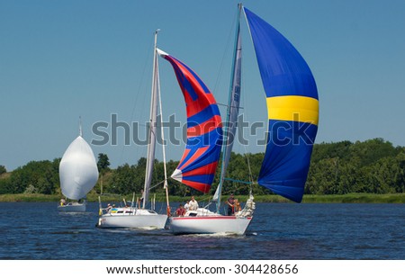 Pereyaslav Khmelnitsky , Ukraine, August 1, 2015:  Sailing Regatta, Cup of Pereyaslav 2015. Yacht on full sails compete with each other and race to the finish line.