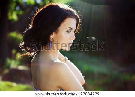 bright picture of lovely brunette woman in sunlight