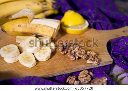 Still-life with bananas, nuts and lemon