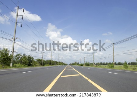 Cloud on road with  the yellow line share lane side the electric poles