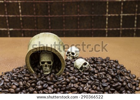Skull in a bamboo cup placed on coffee beans., Still life photography style image blur.