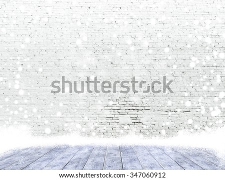 empty brick wall with ice cover a wooden floor and snowing ,Ready for product display montage.