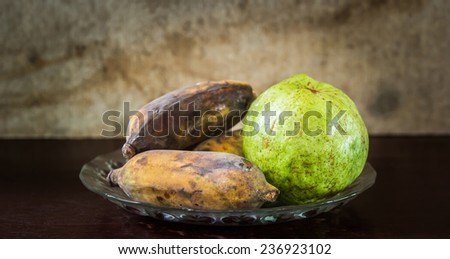 Grunge still life of interior, a table and a fruit tray