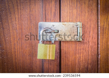 Closeup wooden door with key no lock