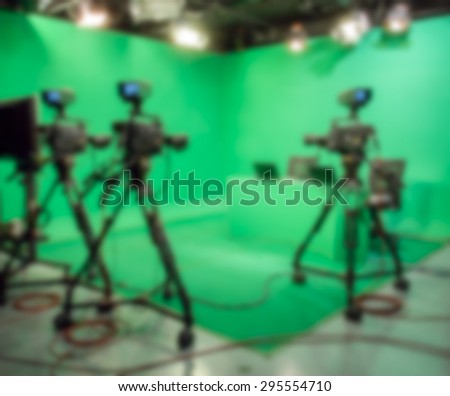 blurred image against television studio with camera