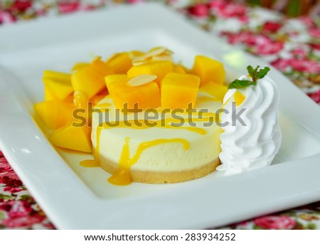 Mango cheesecake on white plate