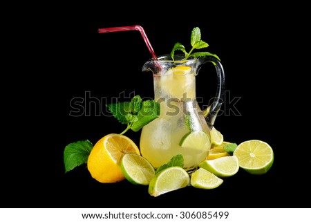 fresh lemonade with mint and lemon isolated on black background