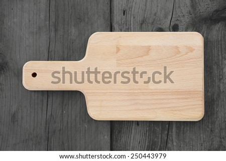 empty cutting board on dark vintage planks food background with copy space