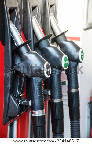 gas pump nozzles in a service station, upright