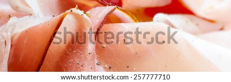 close up of ham as  header for a food website, blurred to the right side with copy space for logo and text