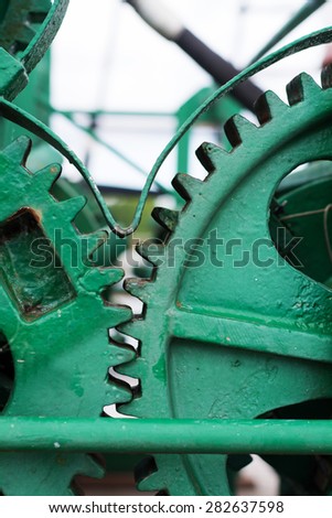 green painted big gear wheels, object detail of an industrial machine
