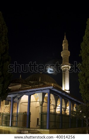 Night photo of Mosque of Suleiman in Rhodes Town with a crescent moon in the sky