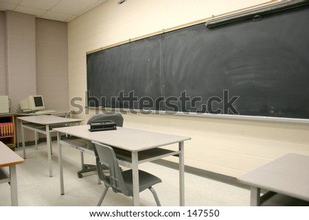 An empty classroom with blackboard