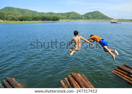 Boys jumping to water, Funny playing