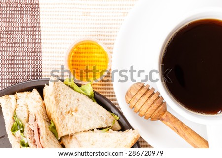 Breakfast coffee honey bacon and sandwich. Food concept.