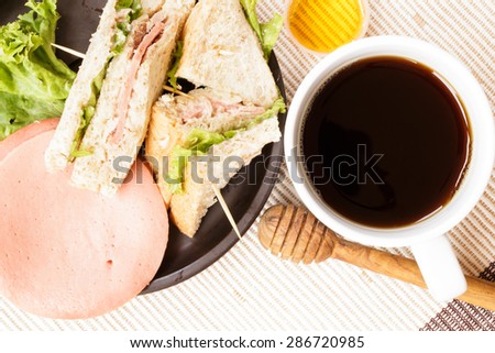 Breakfast coffee honey bacon and sandwich. Food concept.