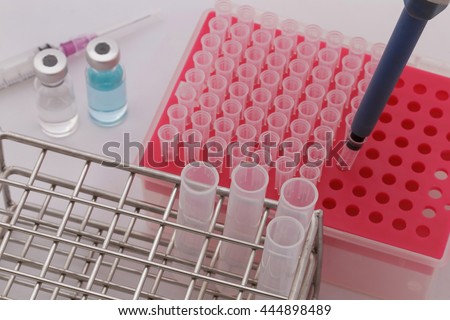 Pipette adding tips and test tubes in laboratory.Selective focus.Medical equipment.