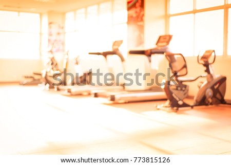Blurred fitness equipment in luxury gym.Sport tools in training class room.