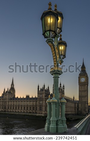 Victorian ornate street lights on Westminster Bridge with the Houses of Parliament in the background at sunset