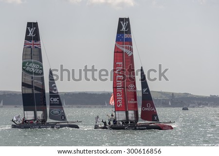 PORTSMOUTH, UK - JULY 25: The Team Emirates and Land Rover BAR America\'s Cup boats sailing in the America\'s Cup World Series qualifiers in Portsmouth shown on July 25, 2015 in Portsmouth, UK