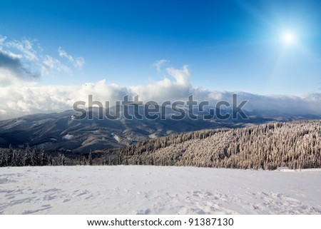 High mountain landscape with sun (Alps in winter)