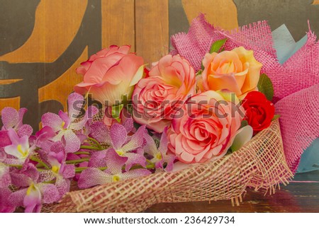 Rose fake flower and Floral background. Lot of artificial flowers in colorful composition