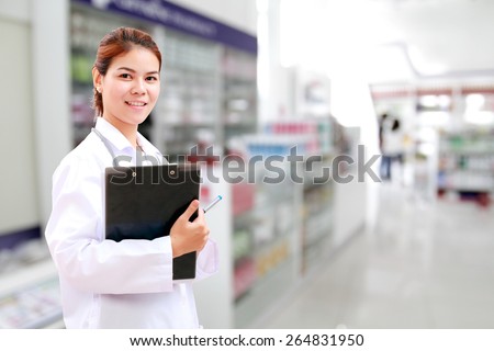 pharmacist chemist and medical doctor woman asia with stethoscope and clipboard checking medicine cabinet and pharmacy drugstore .