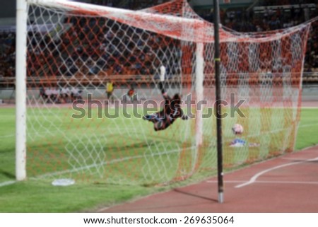 blurry goalkeeper jumps and blocks and Football(soccer) goalkeeper protecting the ball