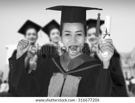 Students with congratulations graduation celebrating and happy girl student on black/white tone.
