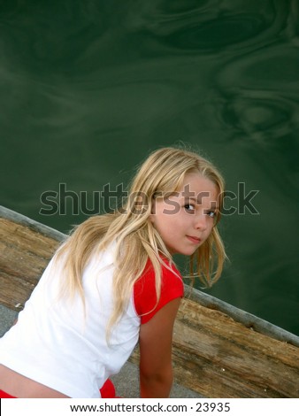 stock photo Young preteen girl on a dock Save to a lightbox 