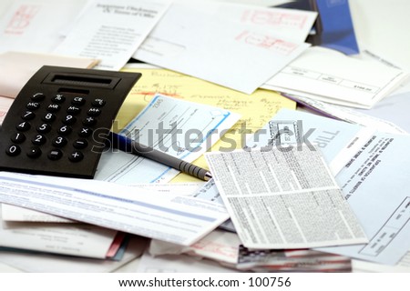 Calculator, legal pad and receipt book, paycheck and lots of bills