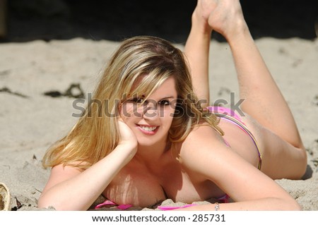 Pretty blonde bikini model at the beach.