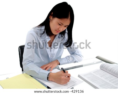 Female student intently concentrating on an English Exam