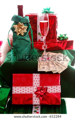 Christmas gifts spill from Santa Clauses bag next to a table where some good girl or boy left Santa a bottle of wine and a glass along with a pile of $20.00 bills instead of cookies and milk.