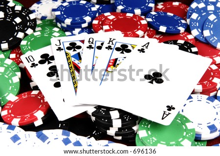 One of the highest hands in poker a Clubs Royal Flush on a bed of poker chips