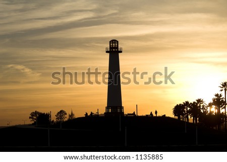 Long Beach Harbor Lighthouse back lit and silhouetted by a Southern California sunset