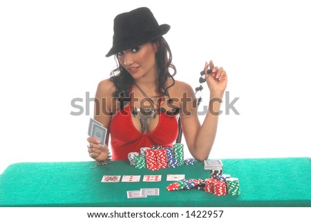 Sexy woman in a sexy low cut red blouse and  black fedora hat playing Texas Hold \'um poker Generic no label card backs from China