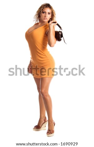 A beautiful Latina woman in a pumkin spice orange knit dress and jute high heels