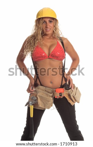 Sexy Latina construction worker in black jeans, suspenders a bikini top, tool belt and hard hat.